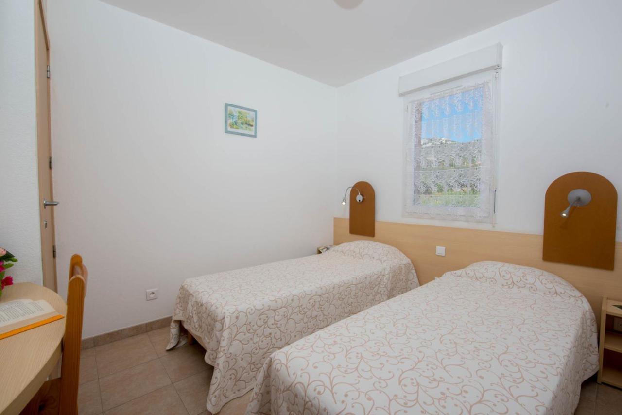 Residence Arinella ลูมิโอ ภายนอก รูปภาพ